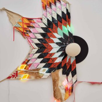 Natalie Ball, Sheriff’s Star, 2022, neon glass, textiles, Billy Jack hat, ribbon, paint, deer hide, 93.5 x 68.5 x 8 in. Loan from Gochman Family Collection. Image courtesy by the artist and Bortolami Gallery, New York. Photographer: Guang Xu